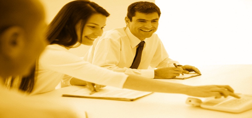 office workers around a conference table, yellow tint