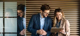 Man and woman looking at tablet