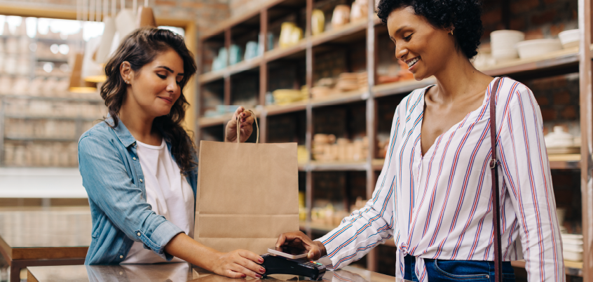 woman making a purchase with a smartphone