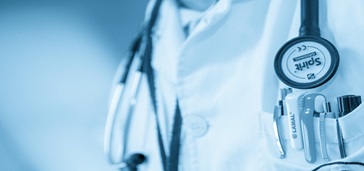 anengagedpatientisahealthierpatient2 stethoscope and pocket full of pens close up, blue tint