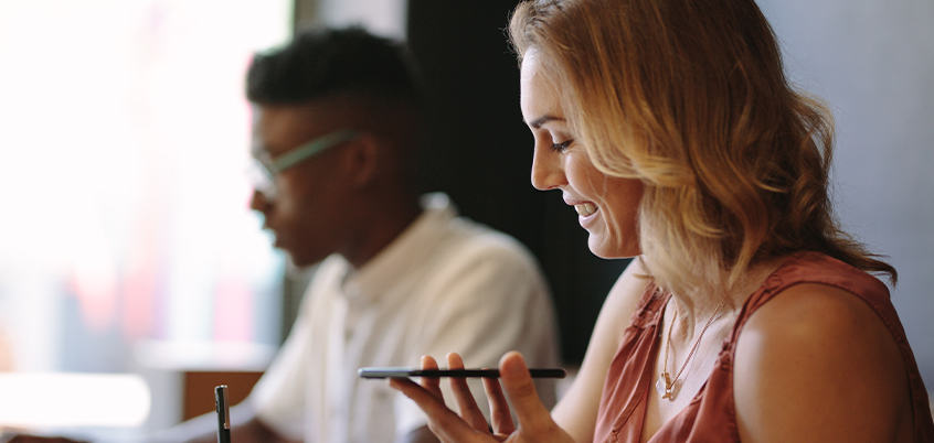 woman working, holding smart phone