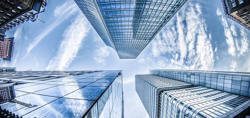 skyscrapers and clouds from below
