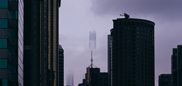 ccb_communityhero_10252019_threat-intelligence Skyscrapers obscured by clouds