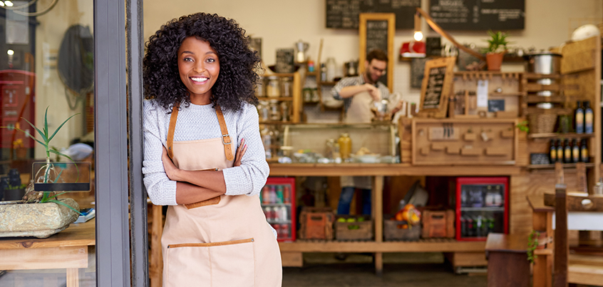 Woman smiling outside of store