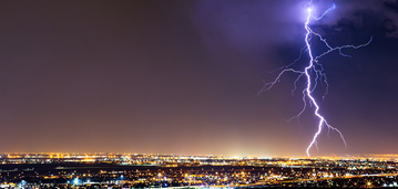 Lightning strike over city.