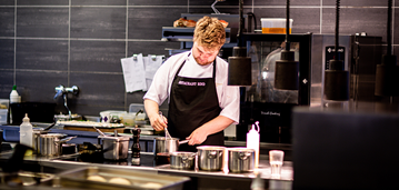 ccb_communityhero_5212020_restaurants_poised_for_a_comeback Chef whisking in kitchen.
