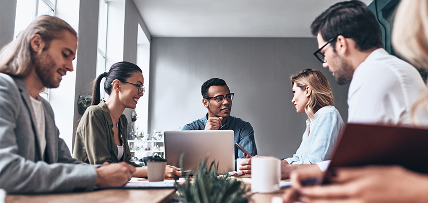 coworkers working on laptop