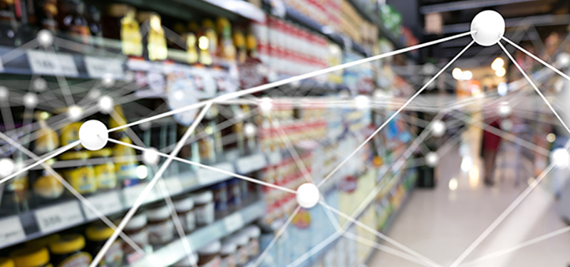 digital network graphic over grocery store shelf