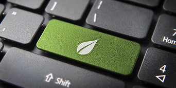 comcast_wp_business-sustainability_112453415 desktop keyboard; closeup of shift key and green key with leaf