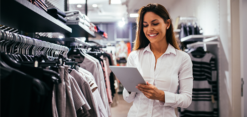 Woman in retail environment using tablet