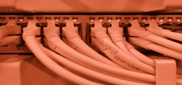 infographicnetworkingbestpractices cables plugged into the wall, red tint