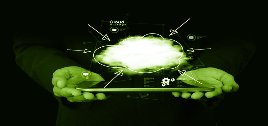 cloud graphic over hands holding a tablet, green tint