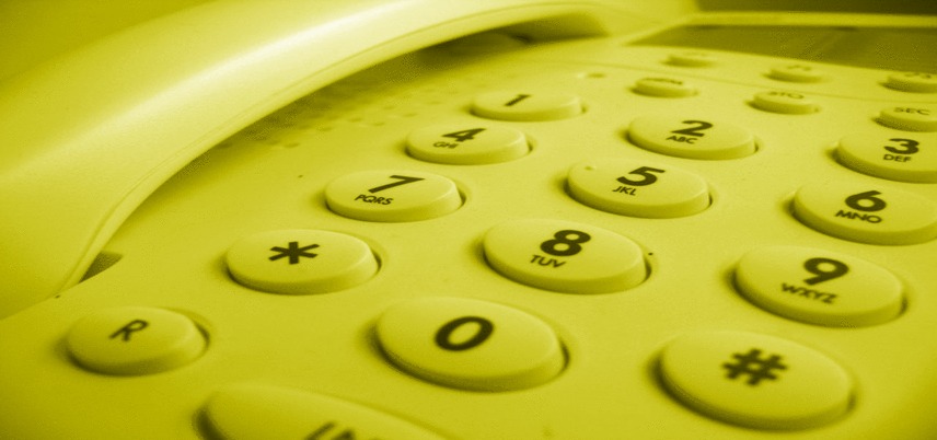 close up of a telephone, yellow tint