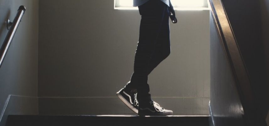 man-climbing-stairs-in-school