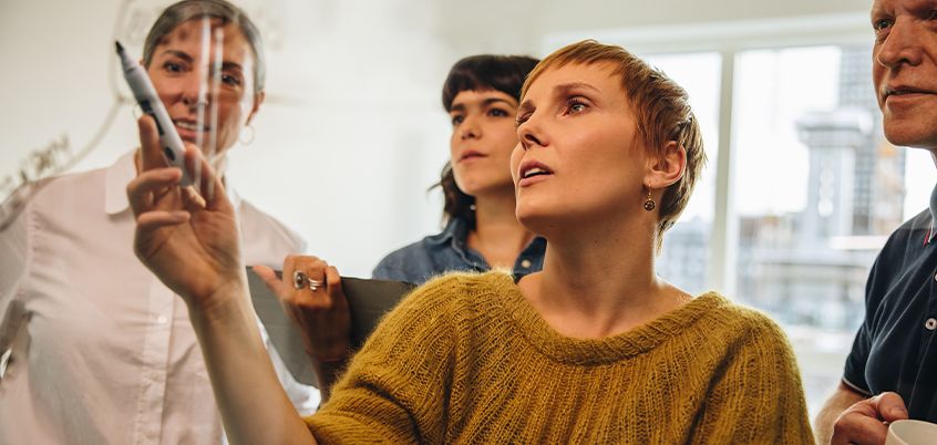 team drawing and working