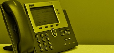 office desk phone, yellow tint over entire image