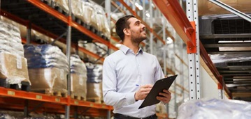 man in warehouse with clipboard